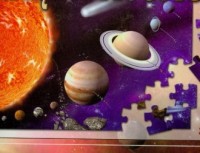 Księga Kosmosu z puzzlami - okładka książki